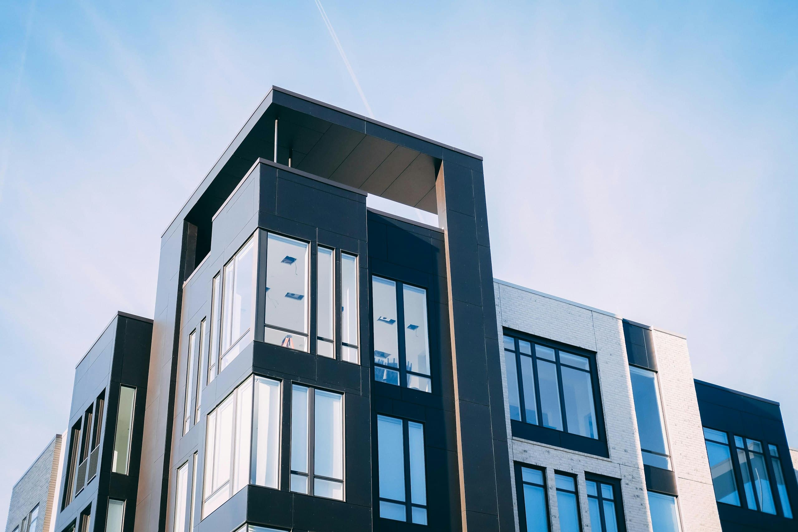 Black and white facade of the Corso Nine apartment building