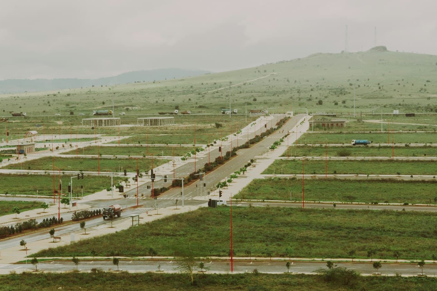 Building plots marked out on a green hillside